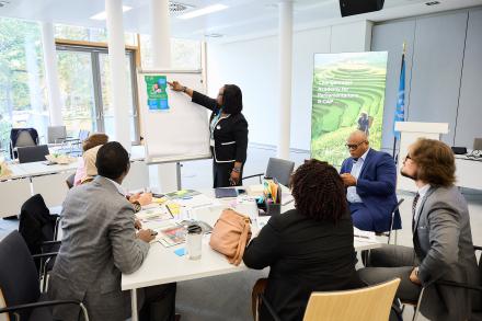 A participant presenting at the Global Changemaker Academy for Parliamentarians 2025