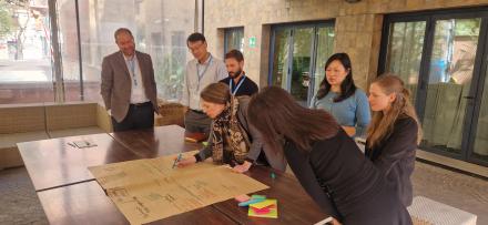 Participants writing on a poster