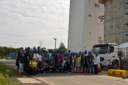 group photo of participants wearing blue helmets