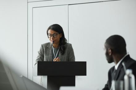 Woman giving a speech at a lectern