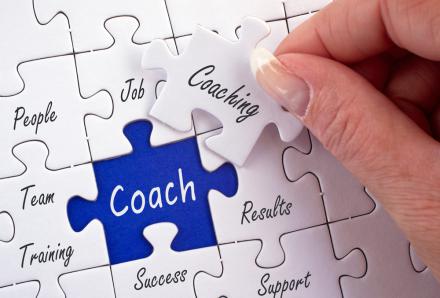 Puzzle piece that reads 'coaching'