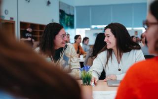 Two JPOs smiling during UNSSC's orientation programme