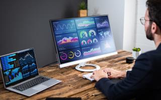 Man reviewing data on computer screen