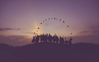 Graduates throwing their hats in the air