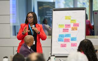 A participant presenting at the Global Changemaker Academy for Parliamentarians 2025