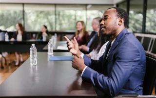 Person sitting at a conference table