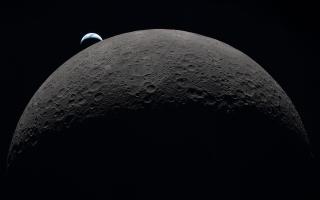 Earth appearing to sink below the lunar horizon