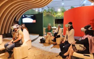 People looking through a VR device