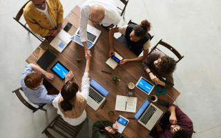 Bird view of people sitting around a table